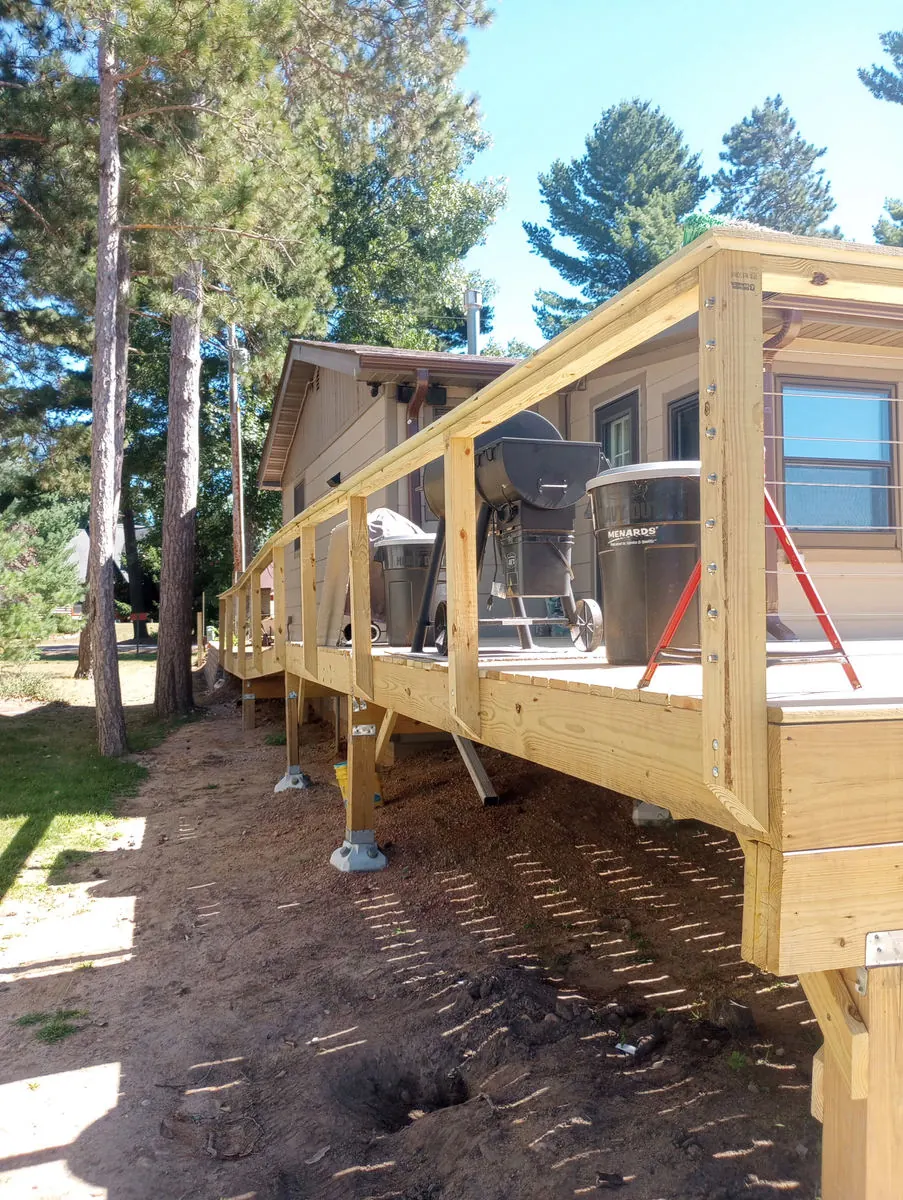 Raised deck with posts on concrete footings